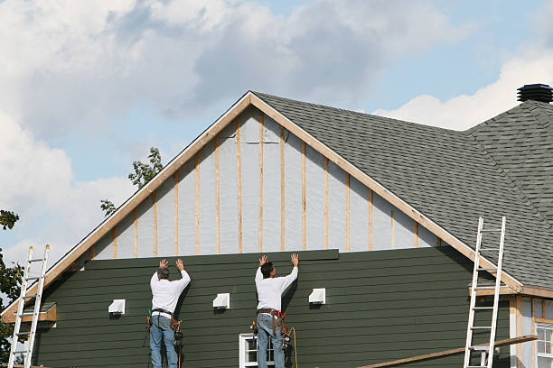 Professional Siding Installation technician working in Center Cross, VA
